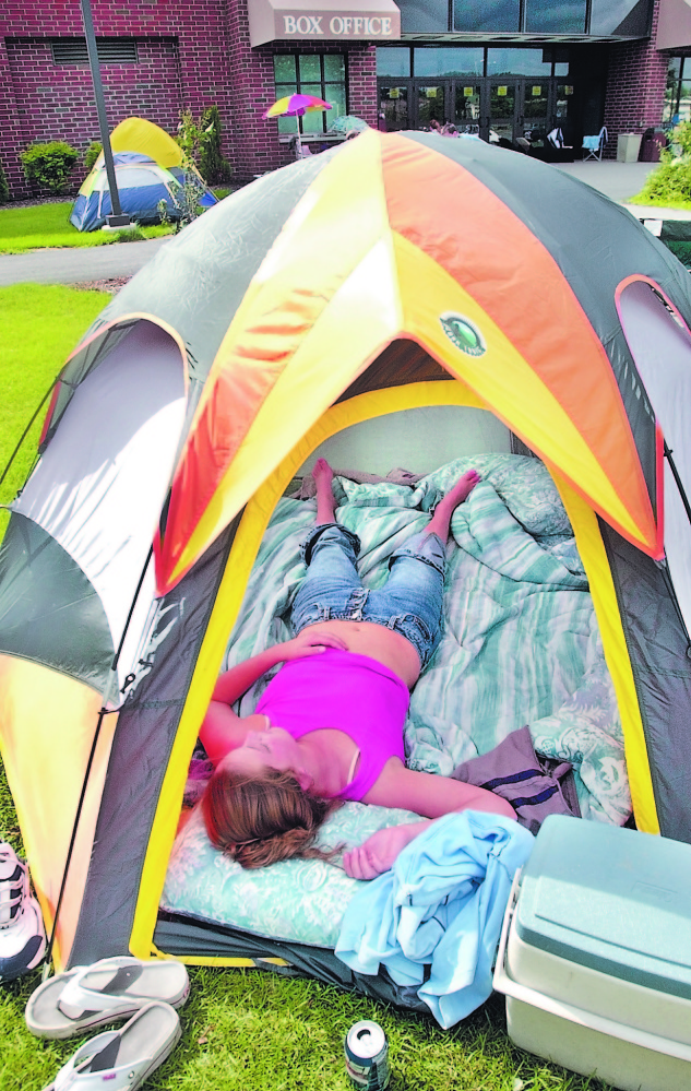 Jamie Stanton, of North Belgrade, sleeps in a tent in front of the ticket booth in 2003 at the Augusta Civic Center. Stanton and 20 other people slept outside the box office to be in line for Alan Jackson tickets, something that hasn’t happened much in recent years as the civic center has struggled to draw big acts. In 2011, Jackson pulled out of a gig in Augusta and instead played in Bangor.