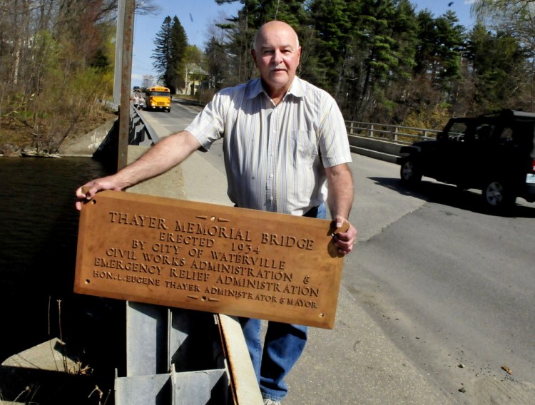 Waterville Public Works Director Mark Turner holds a bronze plaque Wednesday that was recently found in a home that was being demolished and turned over to the department. The plaque was erected in 1935 on the Gilman Street Bridge in Waterville in honor of former Mayor L. Eugene Thayer. It disappeared many years ago.