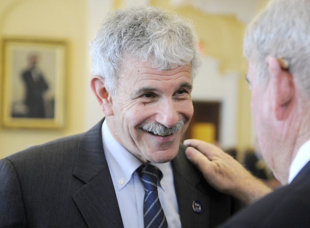 Sen. Roger Katz, R-Augusta, left, speaks last week with former legislator Ronald Usher, a Westbrook Democrat, at the State House in Augusta.