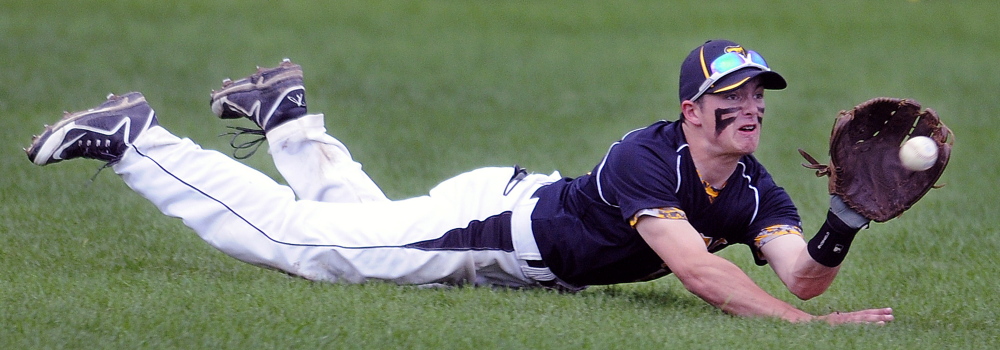 Maranacook left fielder Vinnie Birtwell extends himself to try and grab a pop-up during a game Tuesday afternoon against Camden Hills in Readfield. Camden scored six runs in the top of the seventh to earn an 8-4 victory.