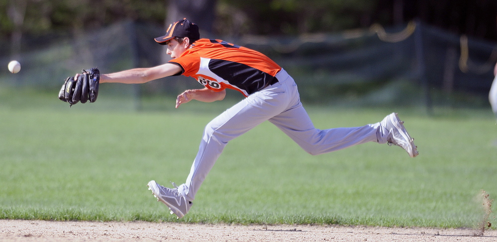 Gardiner Area High School’s Devon Maschino tries but can’t grab a line drive during a game against Maranacook on Monday.