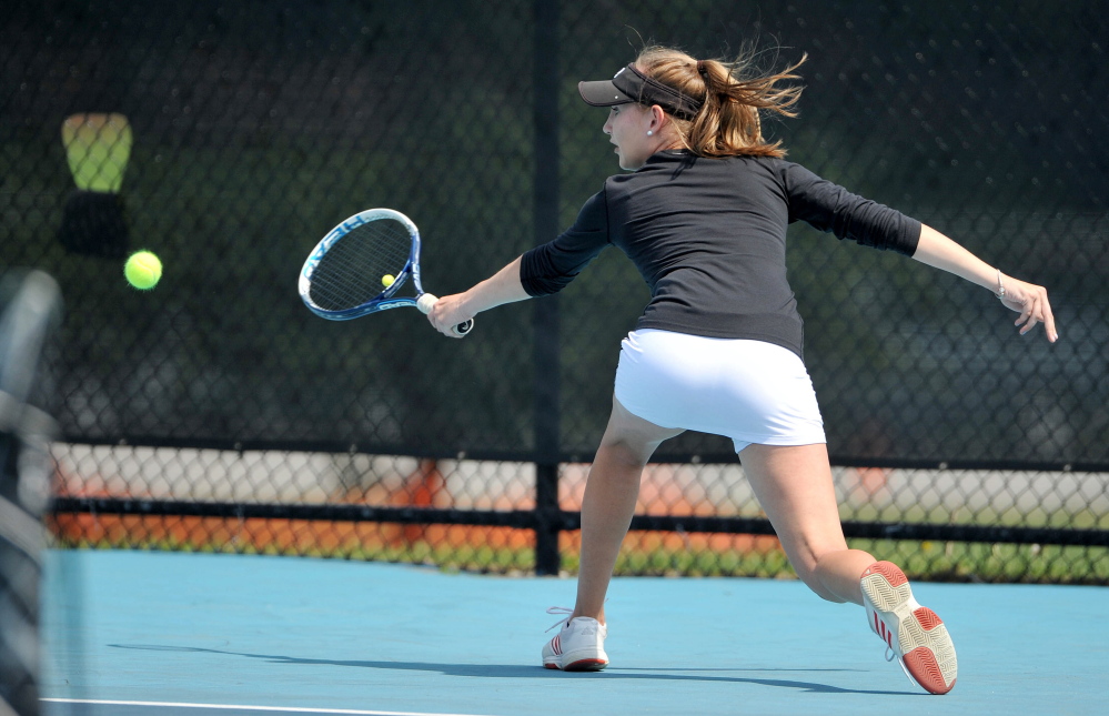 St. Dominic High School’s Bethany Hammond competes Saturday against Cheverus High School’s Natalia Mabor at Colby College in Waterville.