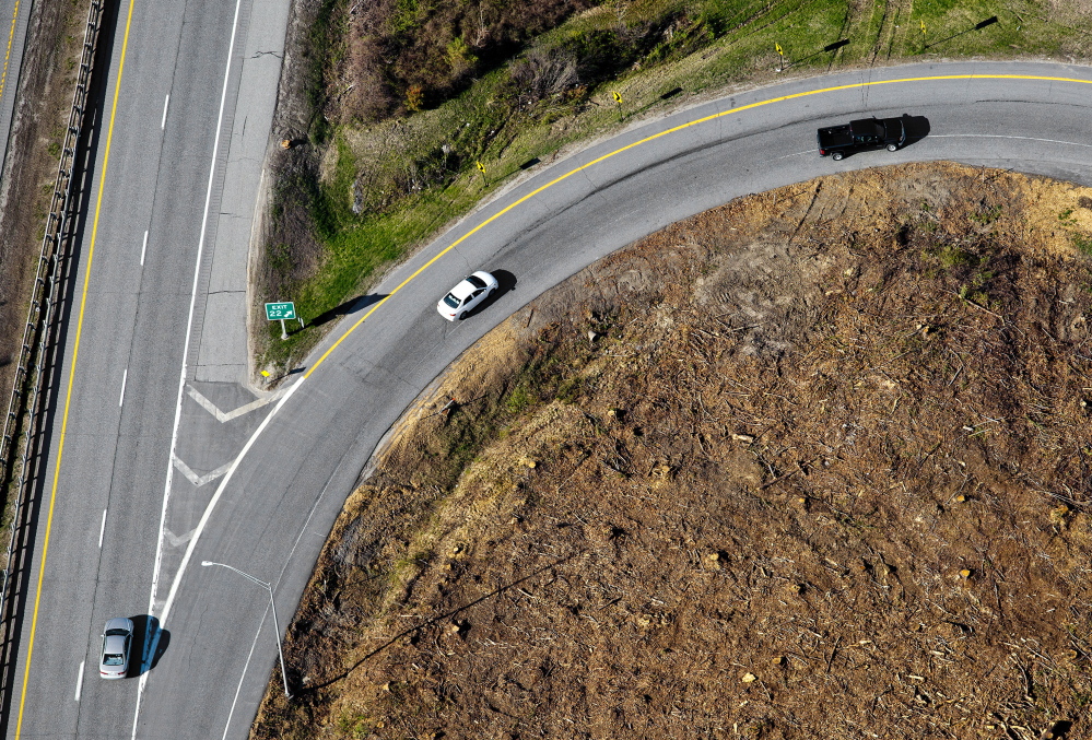 This aerial photograph shows the clearing of brush and trees that the Maine DOT is doing along I-295, The section seen here is along Exit 22 in Freeport.