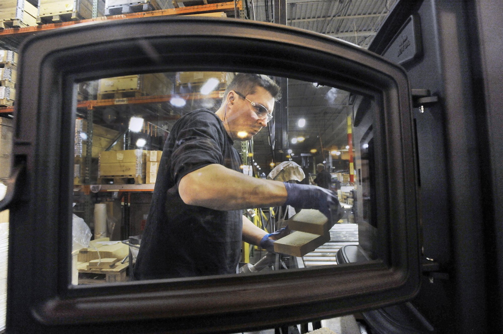 Joe Osmond works on a stove at Jotul North America in Gorham. The cost of energy is not the deciding factor when Jotul is looking to add jobs.