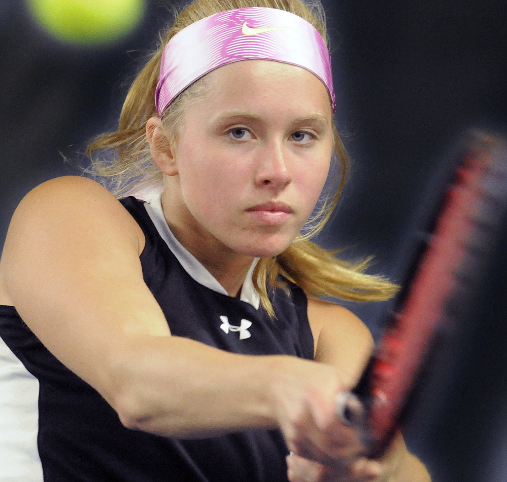 Staff photo by Andy Molloy 
 Hall-Dale High School's Nicole Pelletier returns a shot during a Western C quarterfinal match Hannah Foye of Wiscasset on Monday in Augusta. Pelletier rolled to the victory and so did the Bulldogs.