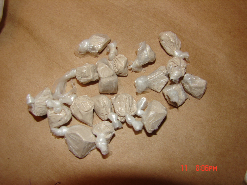 Heroin seized by Waterville police is displayed after three were arrested on drug charges Thursday