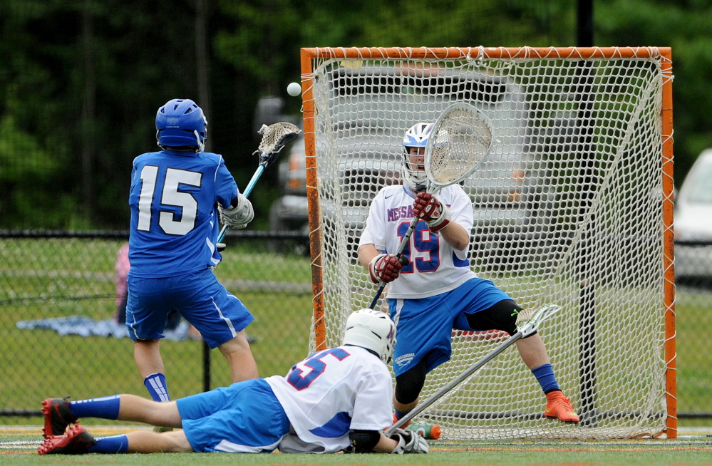 Messalonskee goalie Elijah Teull makes a save on a shot from Lewiston’s Alex Rivet during an Eastern Class A semifinal Friday evening at Thomas College in Waterville.