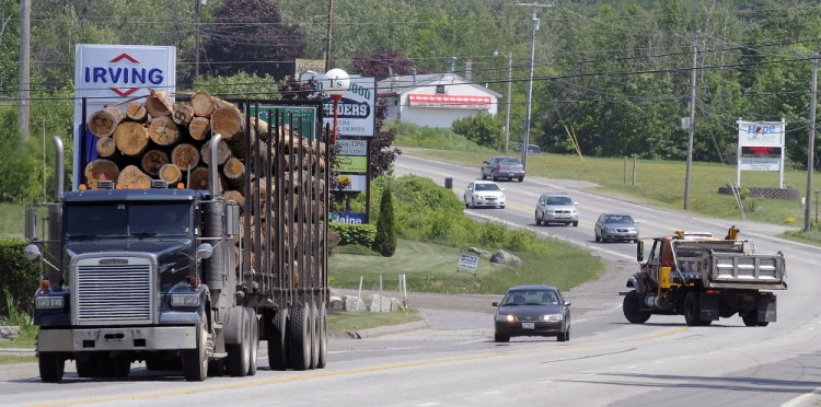 Vehicles travel Thursday on U.S. Route 202 in Manchester, where the Maine Department of Transportation plans to convert the center lane to a left turning lane to reduce accidents.