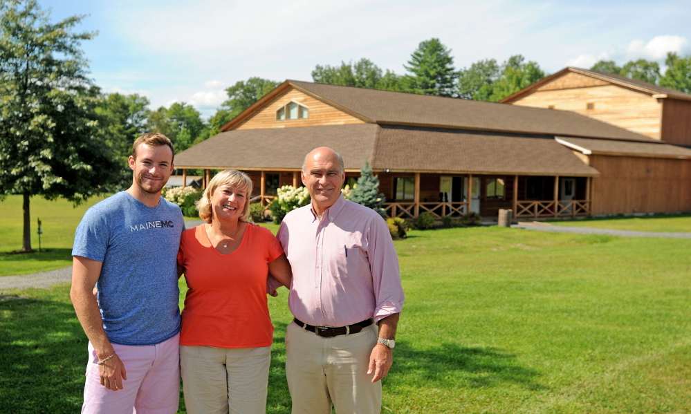 John and Kim Wiggin stand with their son Matthew on Aug. 20, 2014 at the New England Music Camp in Sidney.