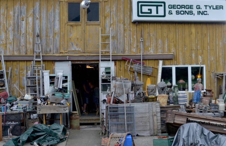 Fairfield Antiques on U.S. Route 201 shown Friday, while not as clean as the town wants it, is significantly cleaner that it was when complaints were first filed against owner Robert Dale.