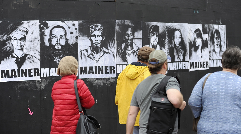 Portland city councilors voted last week to keep providing aid to asylum seekers. A street artist’s portraits became part of the debate on the topic.