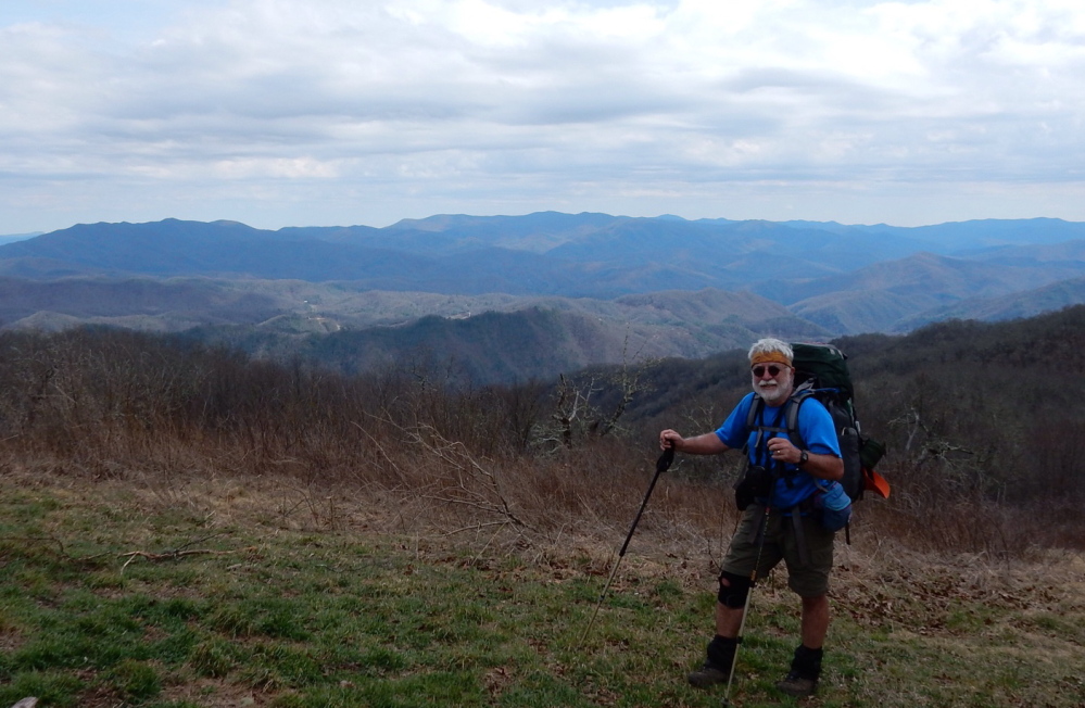 Carey Kish stands atop 5,000-foot Cheoah Bald in the Stecoahs of North Carolina on the Appalachian Trail. This section is part of the 531,000-acre Nantahala National Forest.