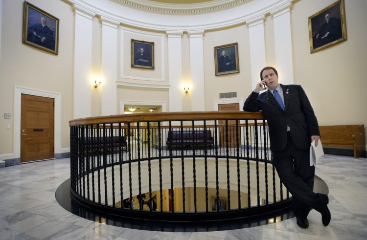 State Sen. Eric Brakey talks on the phone with a reporter at the State House in Augusta. He emerged from political obscurity two years ago when he led a contingent of Ron Paul supporters that unexpectedly took over the Maine Republican State Convention.