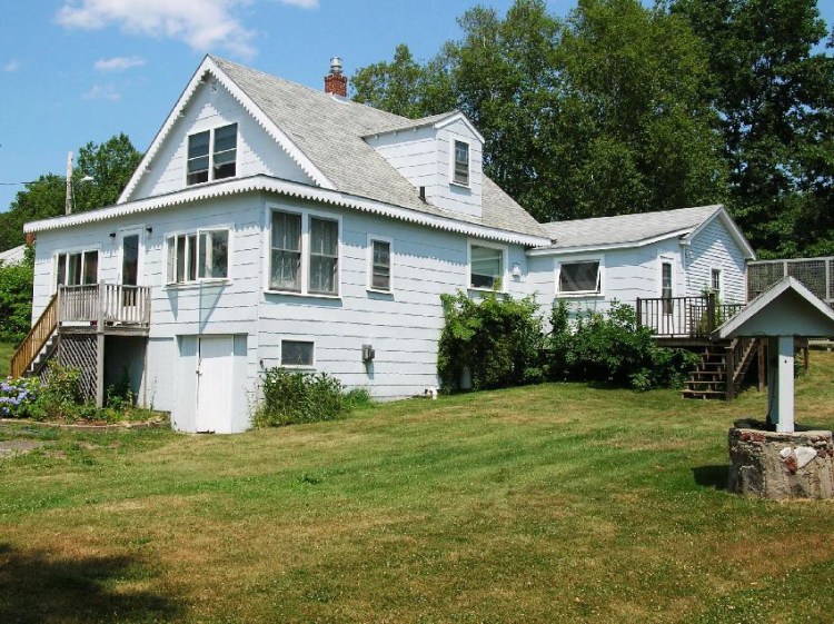 “Sunnyside faces south with Great Pond as your front yard,” says Port Island Realty’s. Toni Muro, the home’s current owner, says she will always cherish the time she spent there.