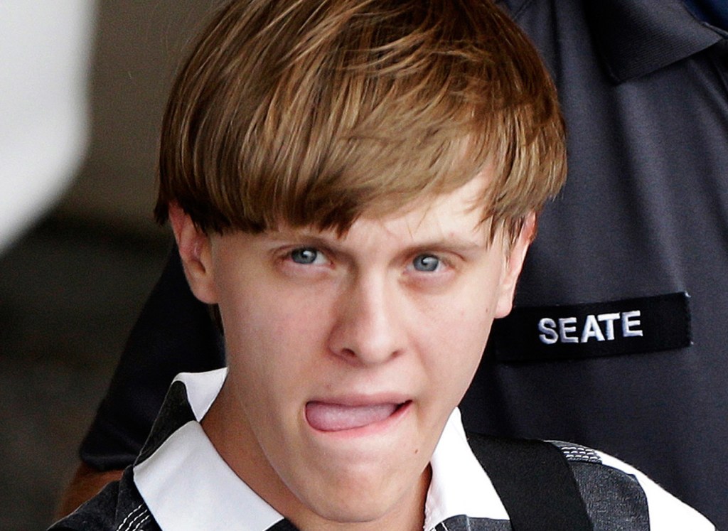 Charleston, S.C., shooting suspect Dylann Storm Roof is escorted from the Cleveland County Courthouse in Shelby, N.C., on Thursday. Roof is a suspect in the shooting deaths of nine people Wednesday night at the historic Emanuel African Methodist Episcopal Church in Charleston. 