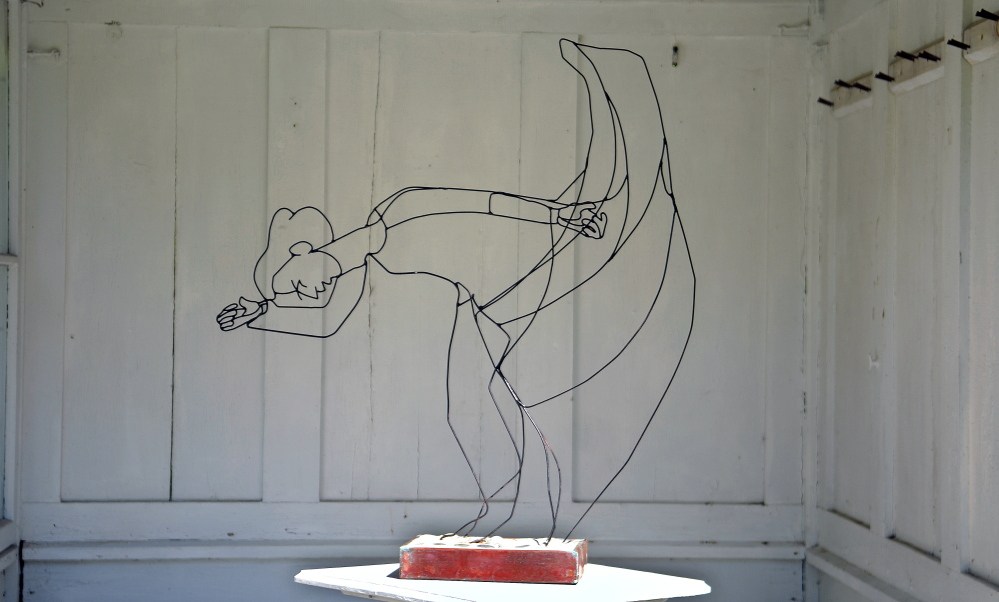 A sculpture by Don Kerr titled “Martha” stands on display Friday in the garden of the Vaughan Homestead in Hallowell.