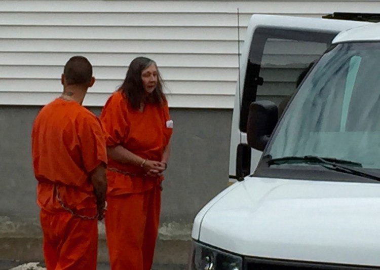 Carol Murphy is led from Franklin County Superior Court on June 12 after a failure-to-appear hearing. Murphy was found in contempt of court in October for having pets after she had been banned in 2005 and 2010 from owning animals.