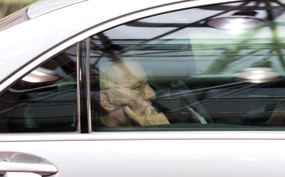 German Finance Minister Wolfgang Schaeuble arrives for a meeting of eurozone heads of state at the EU Council building in Brussels on Sunday.