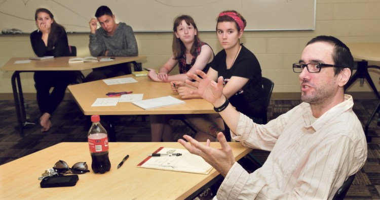 Writing instructor Nathaniel Teal Minton speaks with students Tuesday during a Longfellow writing program at the University of Maine in Farmington.