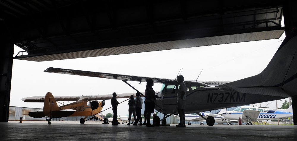 People look at planes on July 2, 2014, during an event commemorating pioneering aviator Amelia Earhart at the Augusta State Airport. The city of Augusta has agreed to a five-year contract to operate the state-owned airport.