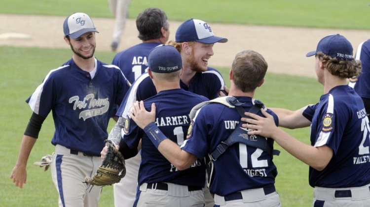Staff photo by Joe Phelan 
 Tri-Town celebrates its 7-6 victory over the Augusta Elks in a Zone 2 tournament game Friday afternoon at Morton Field in Augusta.