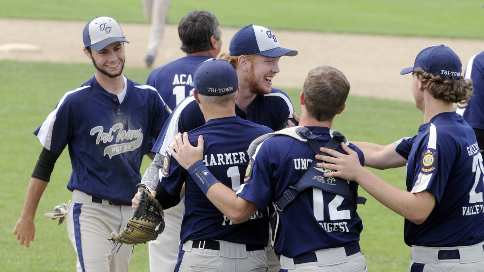 Staff photo by Joe Phelan 
 Tri-Town celebrates its 7-6 victory over the Augusta Elks in a Zone 2 tournament game Friday afternoon at Morton Field in Augusta.