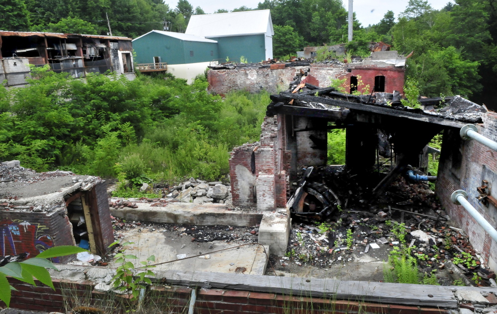 The ruins of the former Cascade Woolen Mill in Oakland on Monday. Two boys were charged with arson for starting a fire in an oil drum at the site. The mill on Cascade Mill Road burned in January 2010.