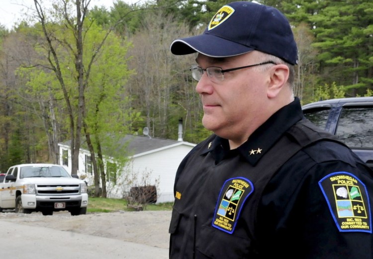 Skowhegan Police Chief Ted Blais speaks on North School Street in May 2014.