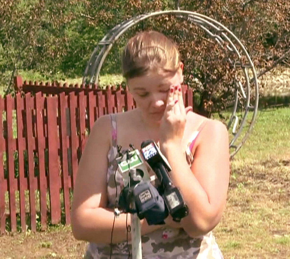 An emotional Brittany Irish talks to the media Wednesday outside her parents’ home in the northern Maine town of Benedicta, five days after she was shot and raped by an acquaintance. Photo courtesy WCSH6-TV