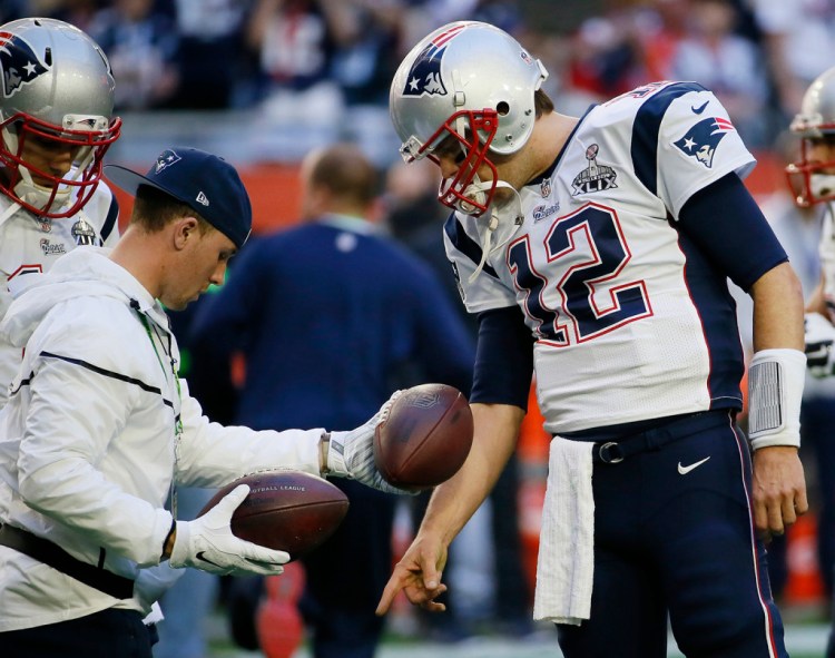 In this Feb. 1, 2015, file photo, New England Patriots quarterback Tom Brady (12) warms up before the NFL Super Bowl XLIX football game against the Seattle Seahawks in Glendale, Ariz. The Associated Press