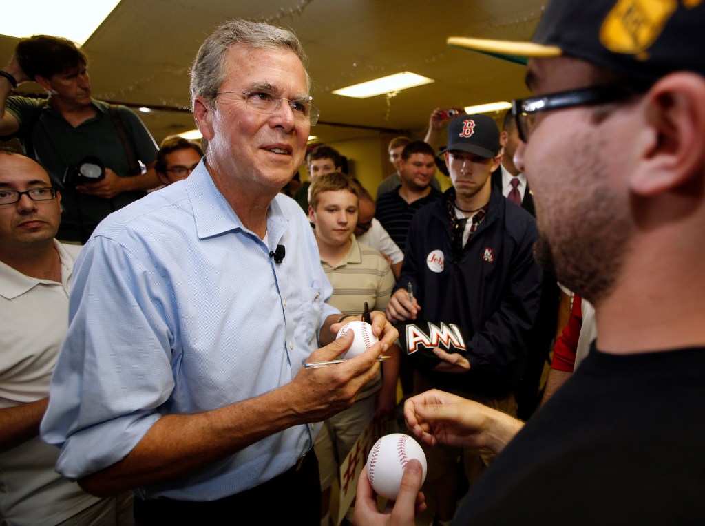 Republican presidential candidate and former Florida Gov. Jeb Bush signs autographs following a town hall meeting Wednesday in Hudson, N.H. Earlier in the evening he  called fellow candidate Donald Trump's recent comments about Mexican immigrants "extraordinarily ugly." The Associated Press