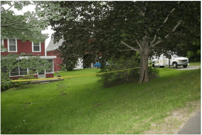 Police tape surrounds a house on Montgomery Road in Boothbay Harbor, where state and local police are investigating a death. 
Courtesy Boothbay Register