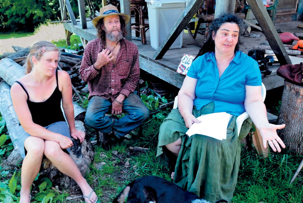 Elizabeth Smedberg, left, and Harry and Cindy Brown, who farm their land and host annual pro-marijuana festivals, spoke about their concerns about a cellphone tower off Abijah Hill Road in Starks in this September 2013 photo. A proposed ordinance would require a permit for exclusive use of a town road such as the Abijah Hill Road, which the festivals have used for parking in the past.