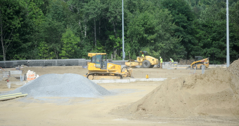 Construction crews work Thursday at Colby College in Waterville.