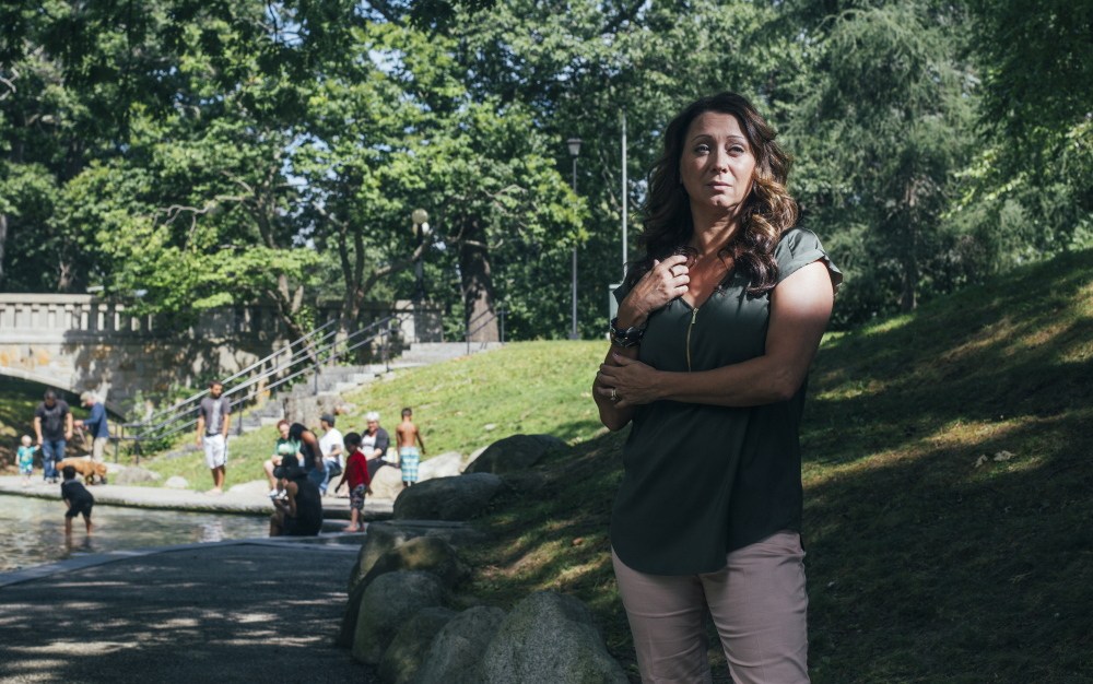 Laurie Bachelder stands near the area where she saw a man overdose near the splash pad in Deering Oaks Park in Portland on Monday. “All I could think about is this is someone’s son. This person has a mother,” Bachelder said. Witnessing the overdose caused Bachelder, who was with her two children at the splash pad, to start volunteering in organizations dealing with opiate abuse.