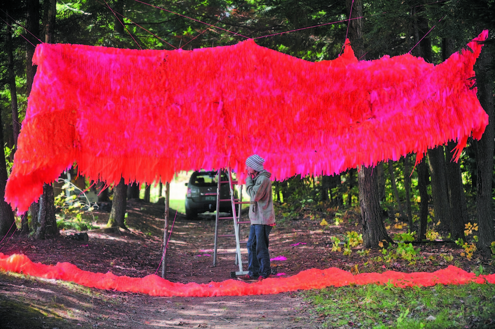 Gabe Kenney helps install an exhibit in the woods during preparations for the first Great North Festival in Norridgewock in 2013. Residents will have the chance to weigh in on this year’s festival permit at Thursday’s Board of Selectmen meeting.