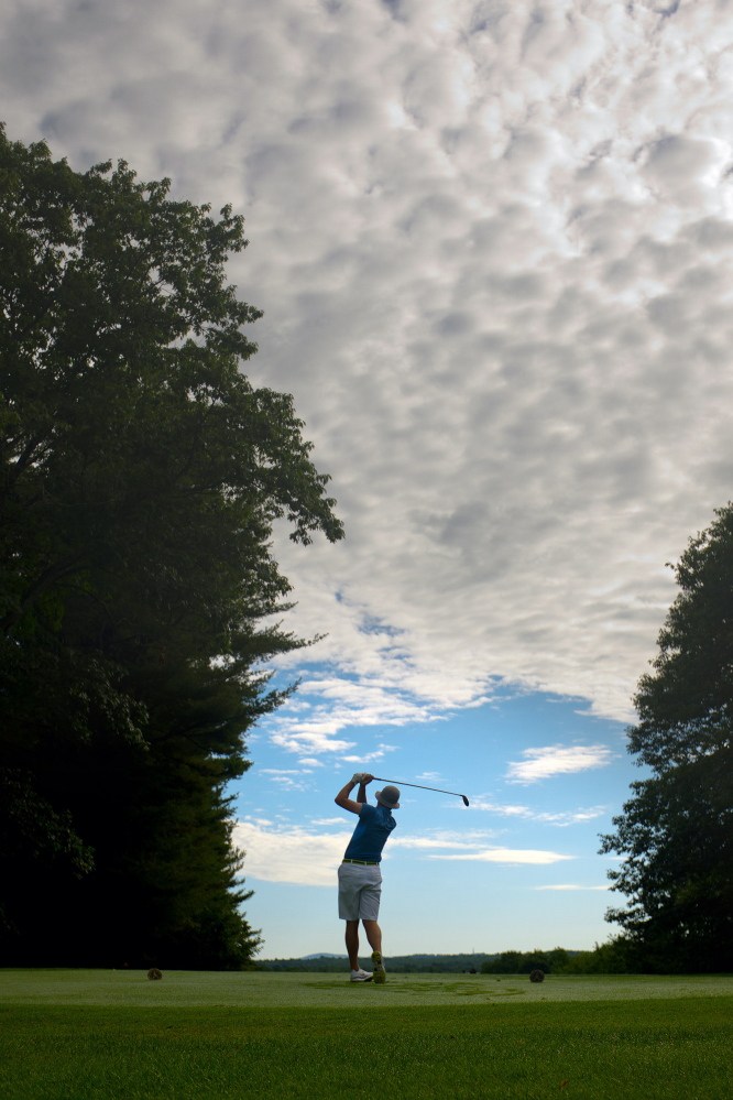 Andrew Slattery of Minot tees off on the 10th hole while competing against Jeff Cole of York in the Maine Match Play Championship at Martindale Country Club in Auburn on Thursday.