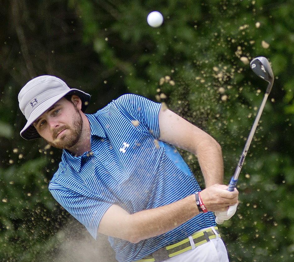 Andrew Slattery of Minot chips his way out of a bunker on the 16th hole while competing against Jeff Cole in the Maine Match Play Championship at Martindale Country Club in Auburn on Thursday. Slattery won the title 2 and 1 with a birdie putt on No. 17.