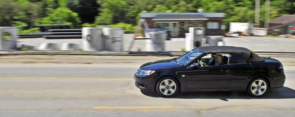 A vehicle drives through the construction zone along Mount Vernon Avenue on Friday in Augusta.