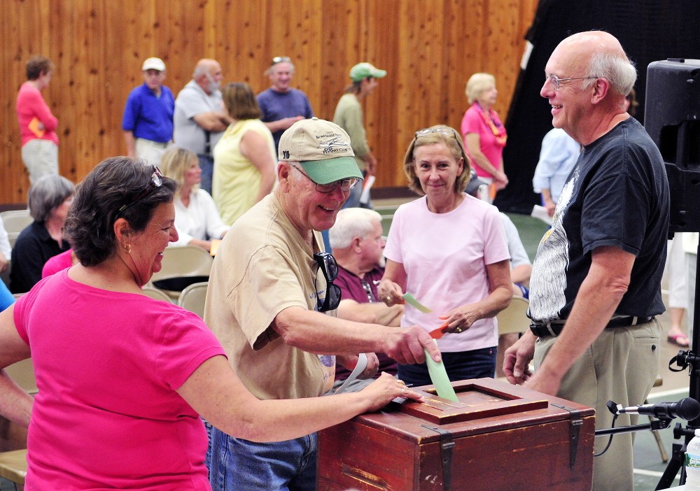 Voters cast secret ballots Saturday on plans to build a new Town Office during the a special town meeting in the Belgrade Community Center for All Seasons.