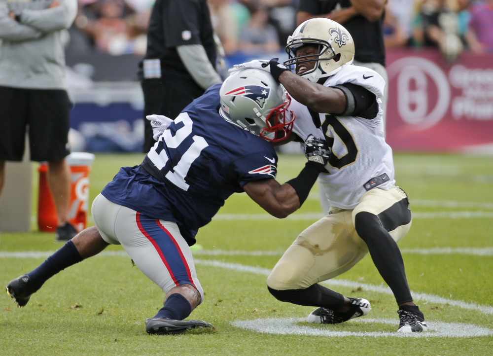 Patriots corner Malcolm Butler, left, tangles with Saints receiver Brandin Cooks during a joint practice Thursday, when Butler bounced back after struggling Wednesday.