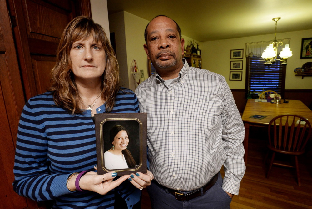 Judi and Wayne Richardson, holding a photo of their daughter Darien, are helping Moms Demand Action for Gun Sense to pursue a vote to expand gun sale background checks.