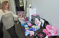 Diana Winkley talks about the comfort bags for patients undergoing cancer treatment last week at Capital Area Federal Credit Union in Augusta.