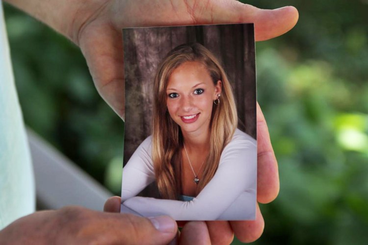 John Zarnoch holds a picture of his daughter Emily Zarnoch of Quincy, Massachusetts, who was killed by a hit-and-run driver early Tuesday morning in York.