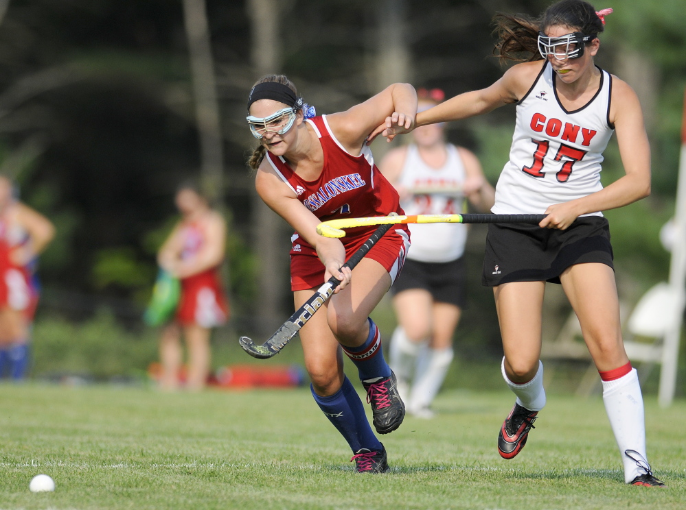 Staff photo by Andy Molloy 
 Cony High School's Olivia Varney, right, collides with Messalonskee's Emily Logan during a Kennebec Valley Athletic Conference Class A game Wednesday in Augusta.