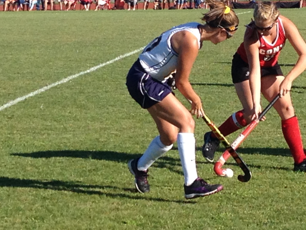 staff photo by Evan Crawley 
 Cony's Delaney Keithley tries to move past a Mt. Blue defender during a Class A North showdown Friday in Farmington.