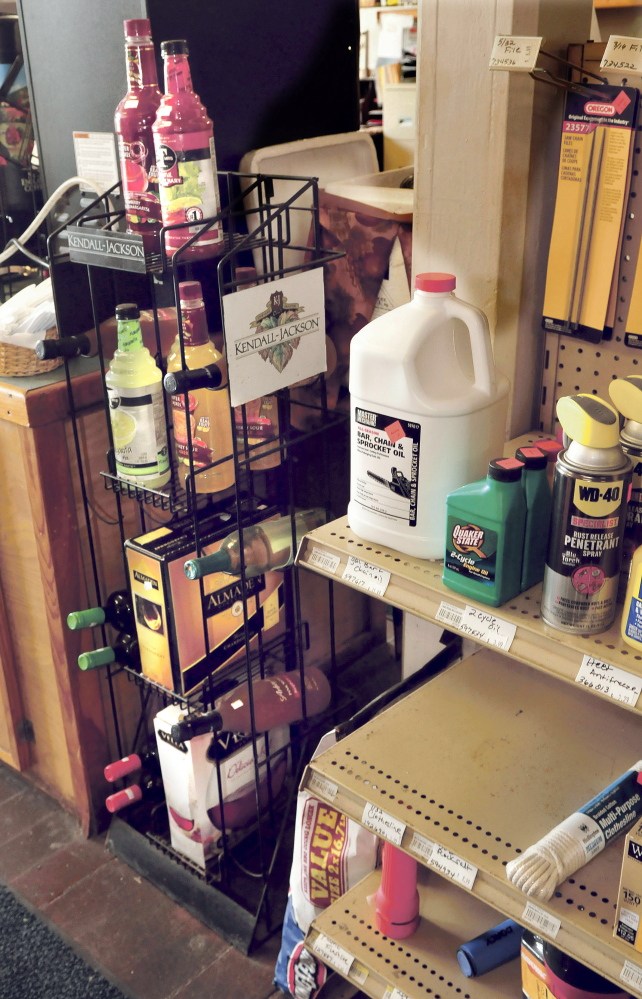 Staff photo by David Leaming
A small rack of wine shares space with other products Aug. 30 at the Cambridge General Store in Cambridge. Such beverages can be sold only on Sunday in the town because of a restriction in a local ordinance.