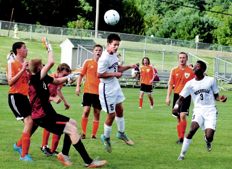 Staff photo by David Leaming 
 Waterville's Ben Danner heads the ball near the Winslow goal during a game Tuesday at Webber Field in Waterville.