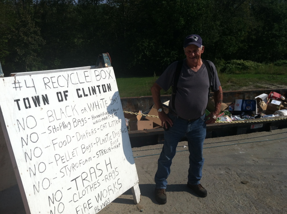 Clinton-Benton Transfer Station Director Gerald Howard stands near a sign informing residents of the station’s  single-sort recycling rules Wednesday.