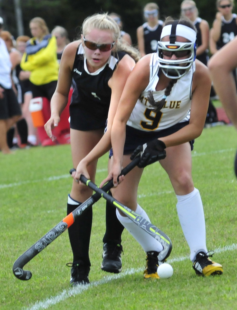 Skowhegan’s Elizabeth York, left, and Mt. Blue’s Kayleigh Fontaine battle for possession during a game Thursday in Farmington. Skowhegan won 2-1.